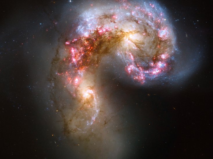 Fotki z teleskopu Hubblea - Colliding galaxies make love, not war.jpg